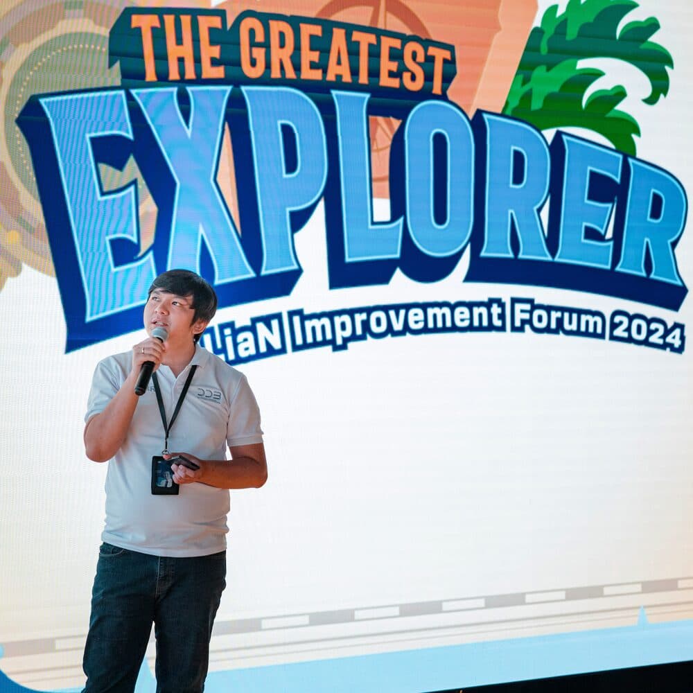 Rudi speaking on stage at BRILiaN Improvement Forum 2024